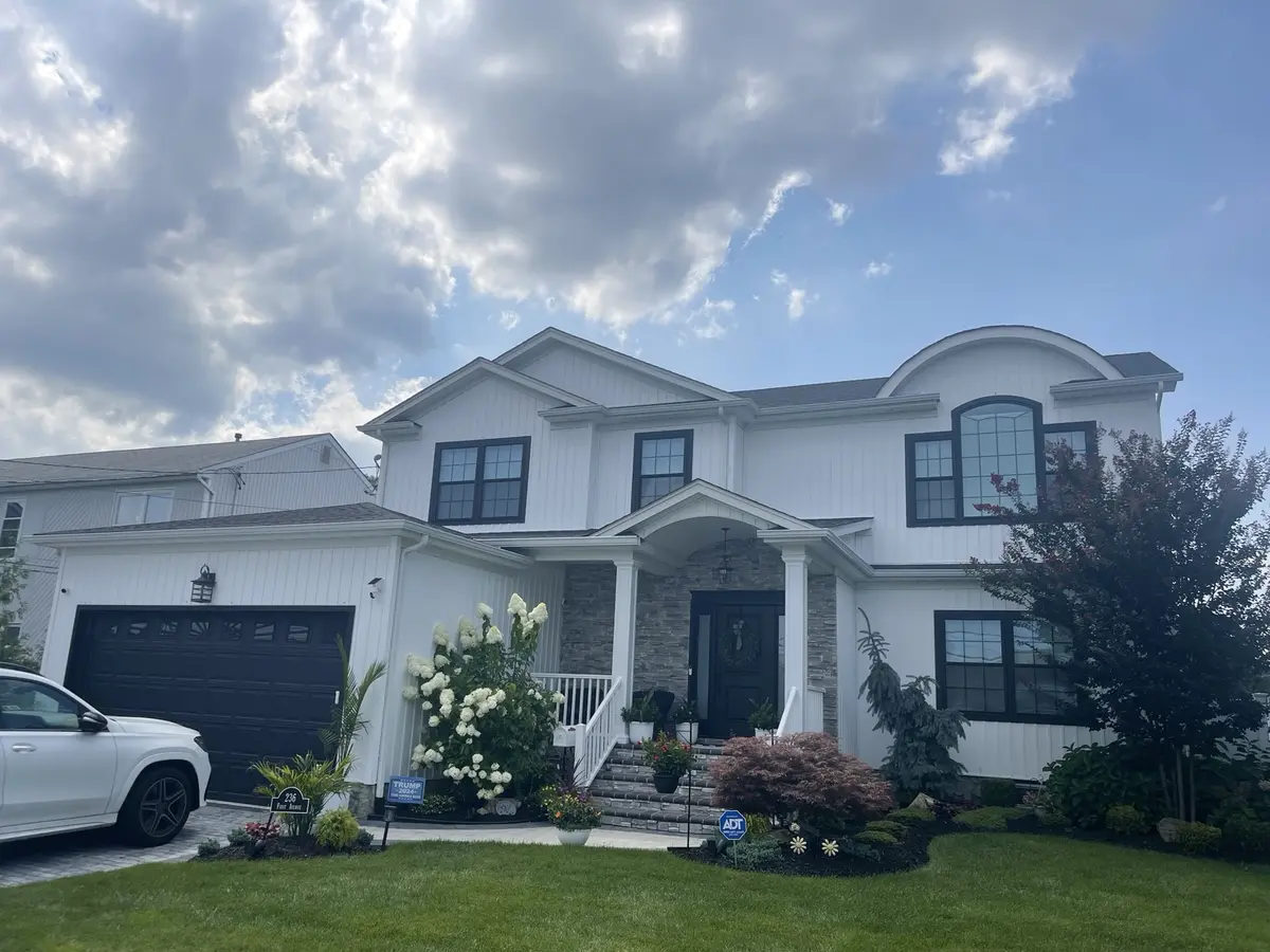 Home before black gutter replacement