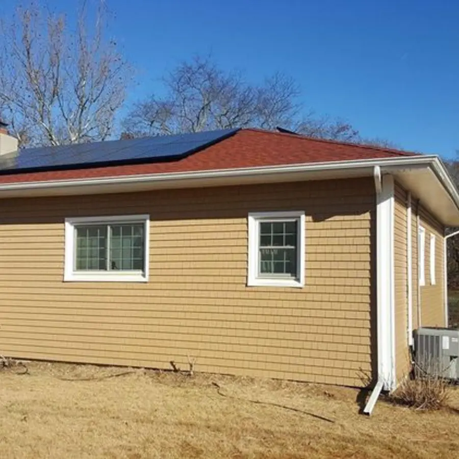 Completed tan siding replacement