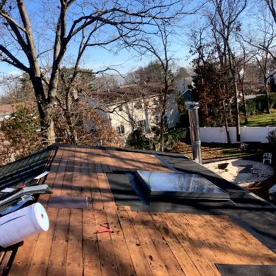 Exposed roof decking around skylights before replacement
